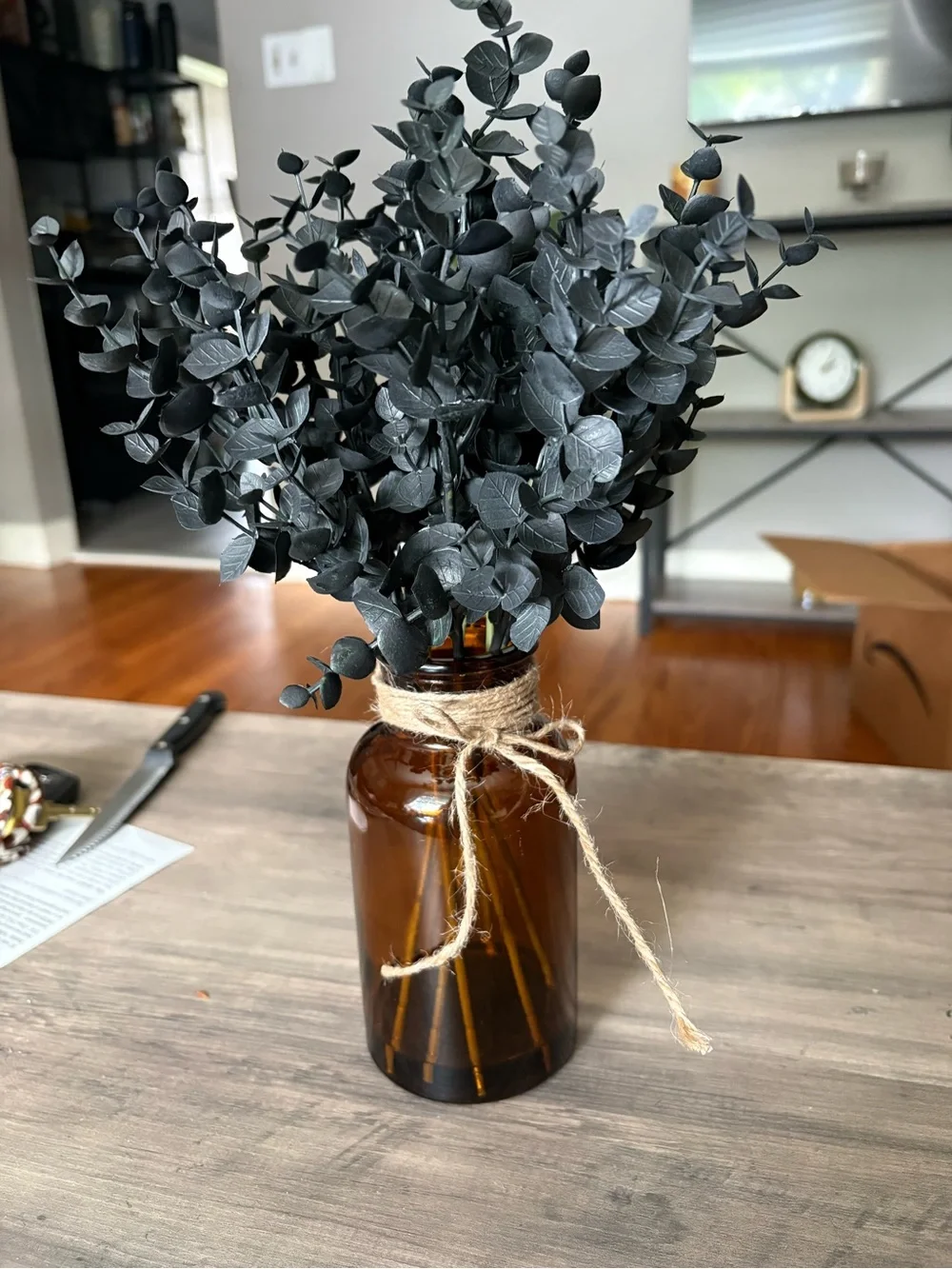 Black Faux Eucalyptus Stems in Amber Glass Vase